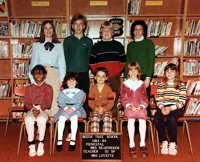 Color photograph of teacher Kathy Lovette’s Cued Speech class taken during the 1983 to 1984 school year. Seven children of varying ages are pictured.