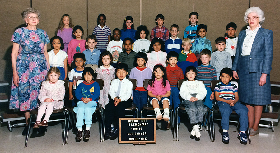 Color photograph of Mrs. Sawyer’s morning kindergarten class during the 1988 to 1989 school year. 28 children and two teachers are pictured. 