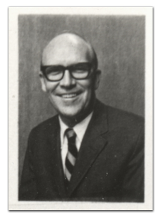 Black and white head-and-shoulders portrait of Principal Waid. The picture comes from a FCPS school directory printed in 1969.