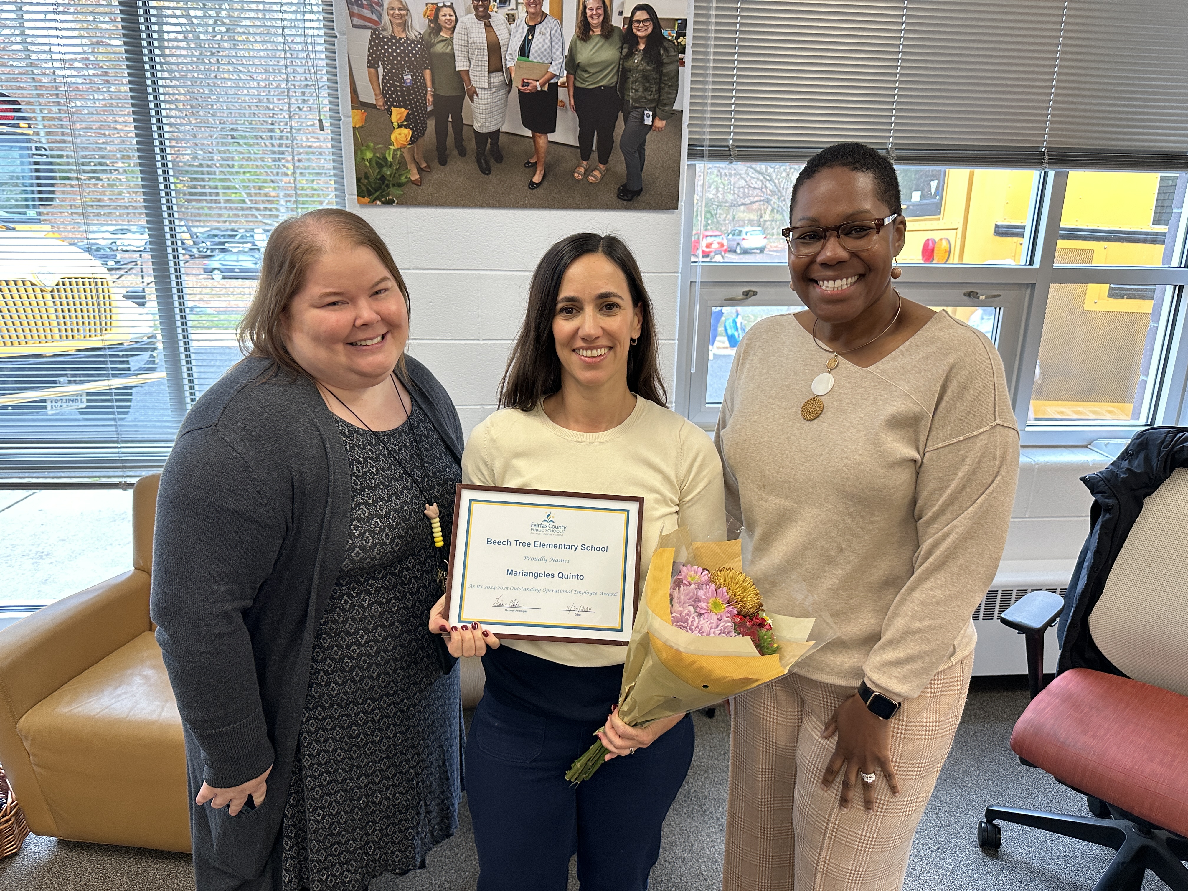 AP Barry, Family Liaison Quinto, Principal Clarke pose for a picture with Miss Quinto's award. 